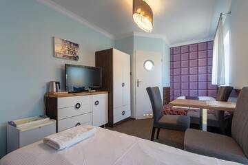 Фото номера Четырехместный номер Апарт-отели Villa 33 Blisko Plaży г. Сопот 8